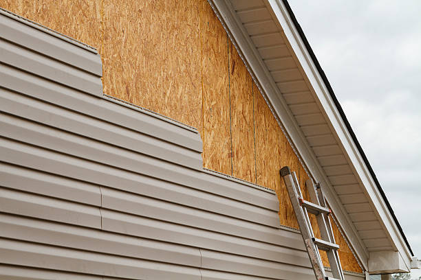Professional Storm Damage Siding Repair technician working in East Rochester, OH